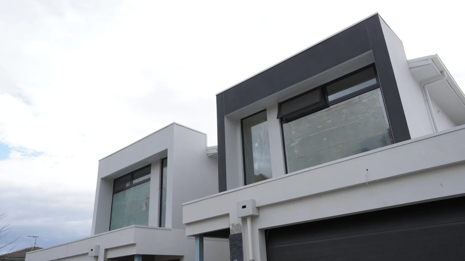Upper facade feature glazing with awning highlights