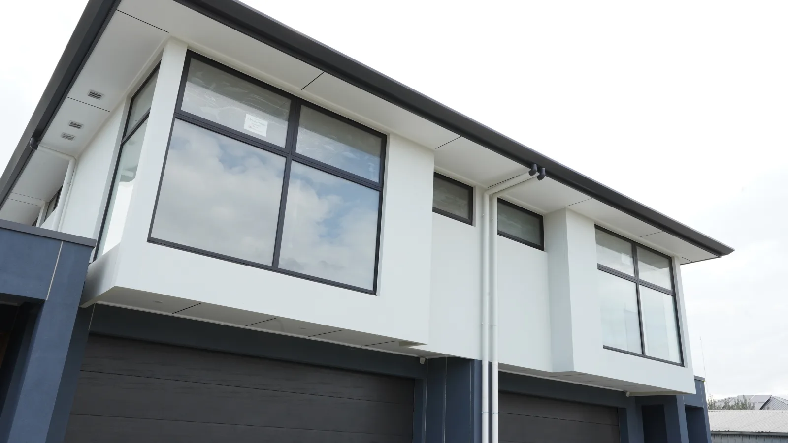 Upper level fixed windows at a contemporary two-storey residence
