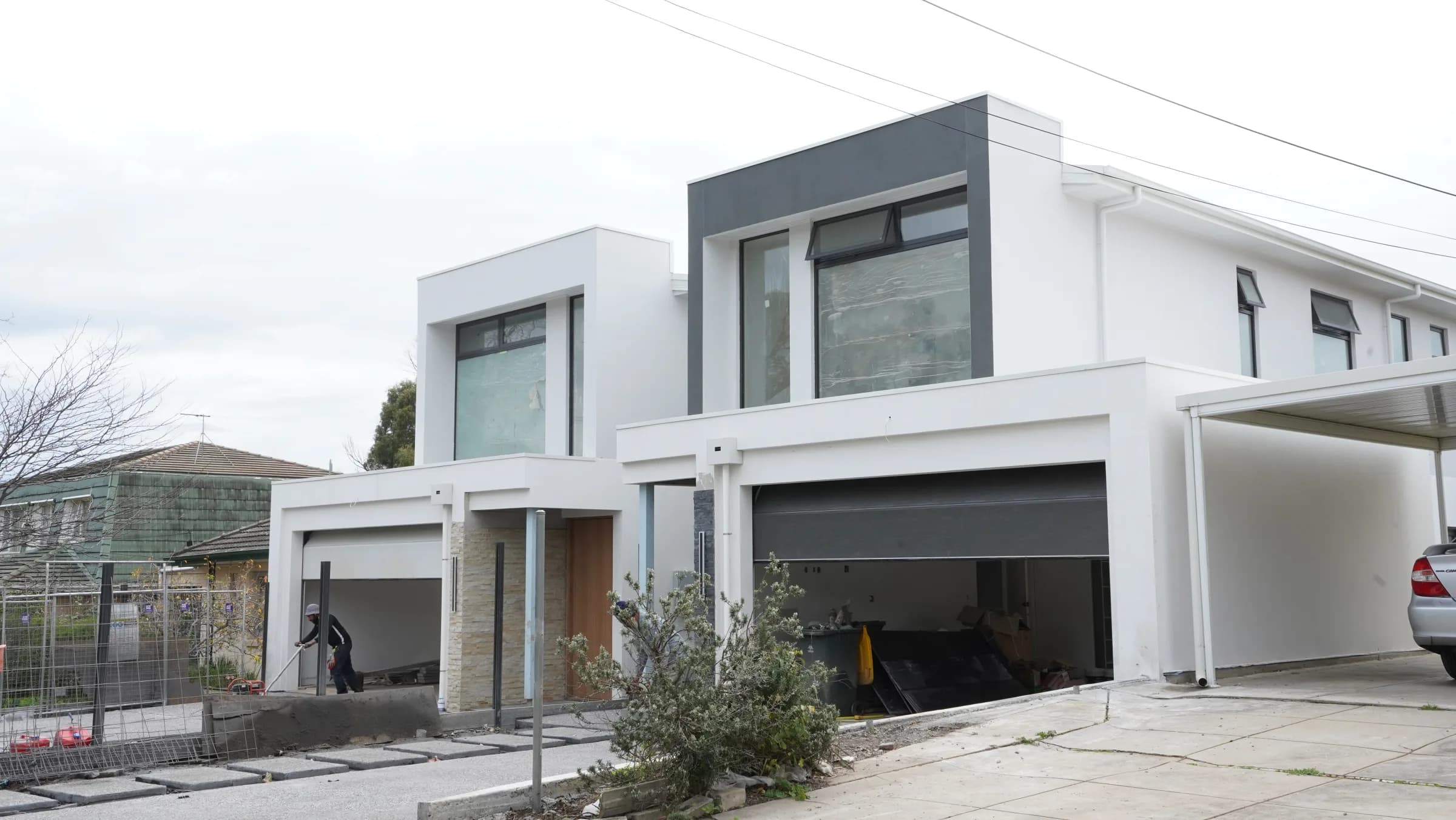 Feature glazing residence with full-height windows and dark frame finishes